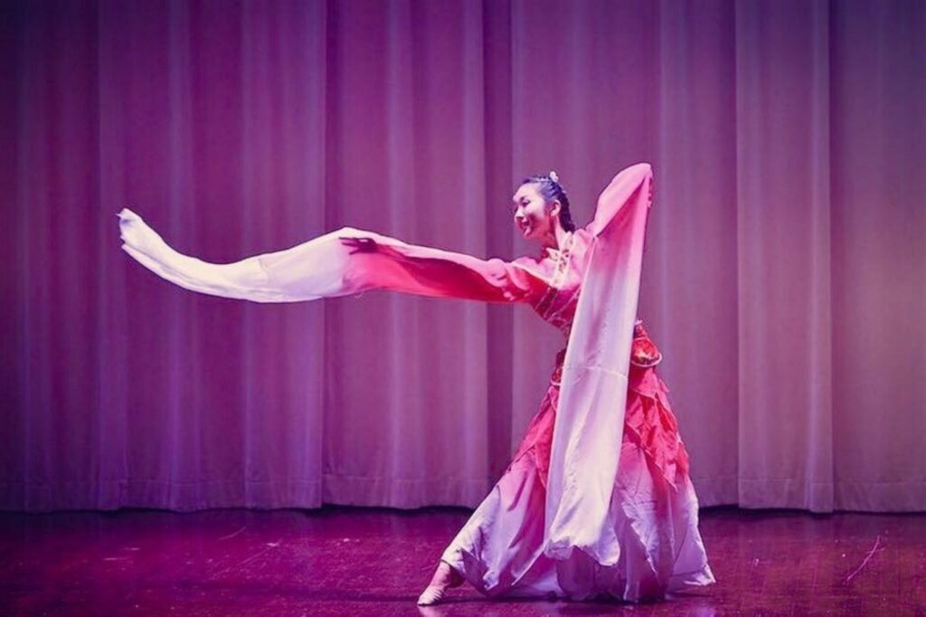 woman in costume while dancing on stage