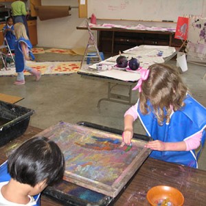 little kids playing with paint
