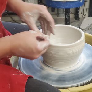forming a clay bowl