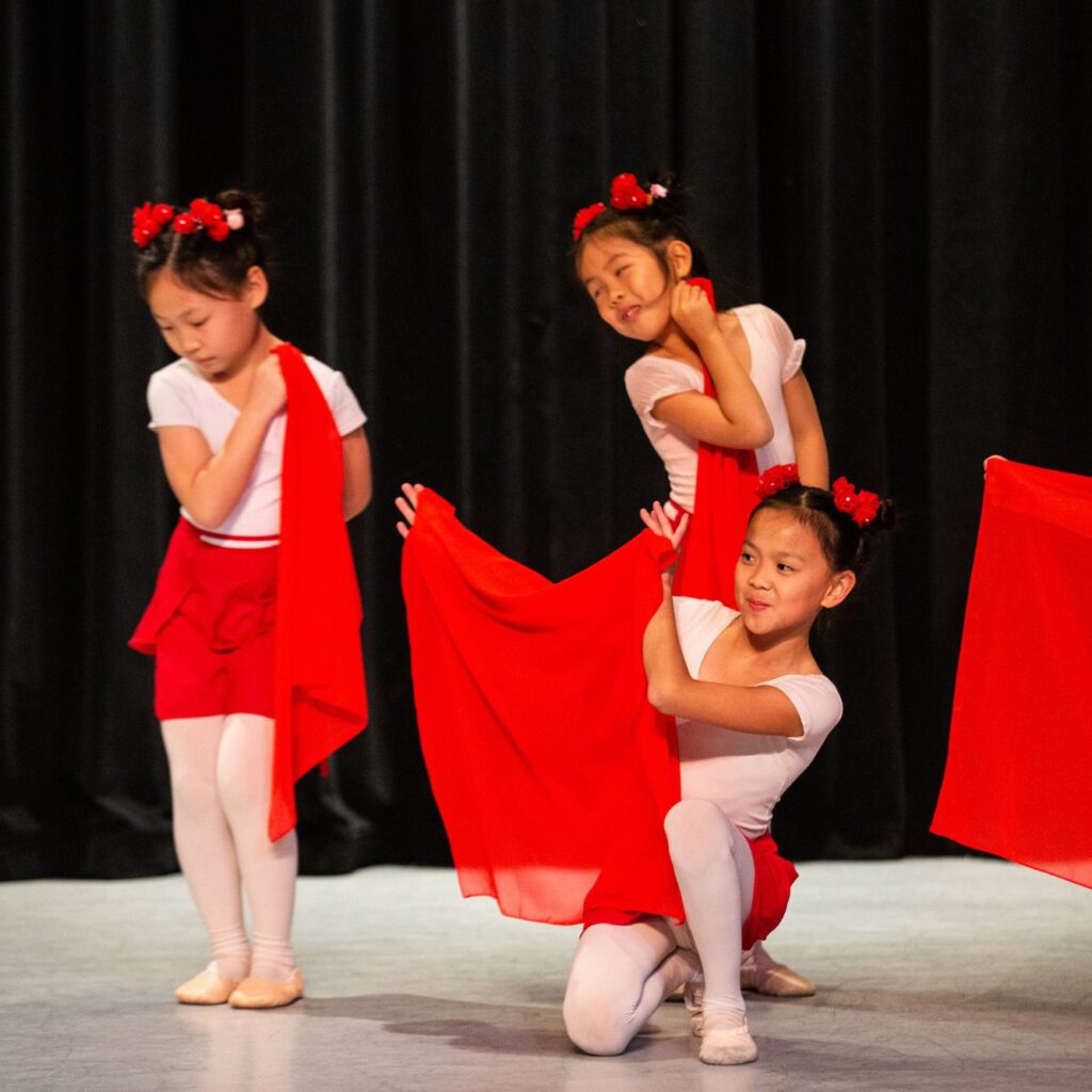 little girls dance on stage