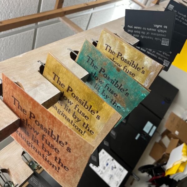 colorful letterpress prints hanging up to dry