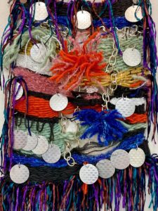 A weaving with chains and sequins by Andreas Braz